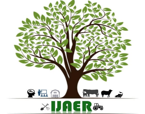 IJAER academic journal on a research desk